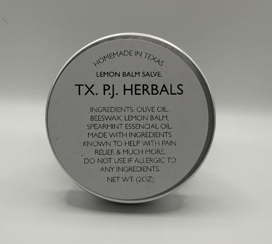 Round tin container of Lemon Balm Herbal Salve by TX. PJ. Herbals with ingredients and usage information on the lid.
