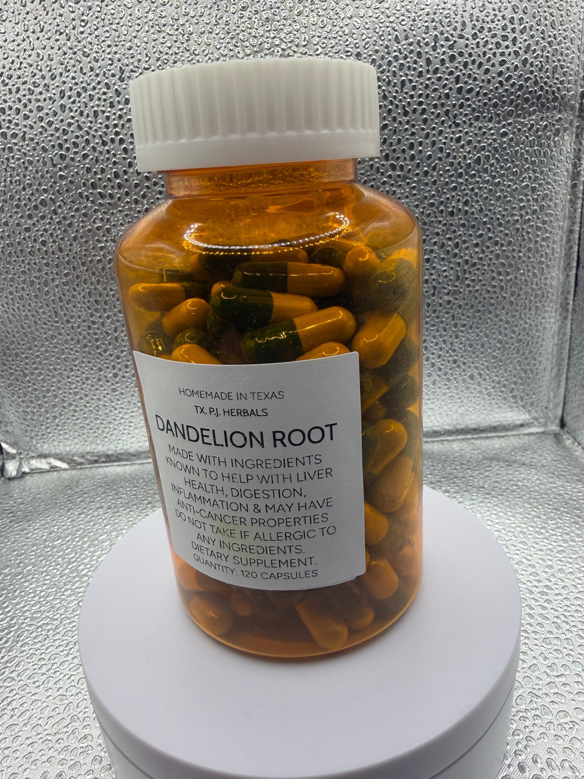 All-Natural Dandelion Root Capsules bottle with fresh dandelion flowers and roots on wooden surface